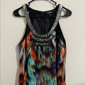 Bebe sleeveless beaded blouse with amazing colorful print. Size L